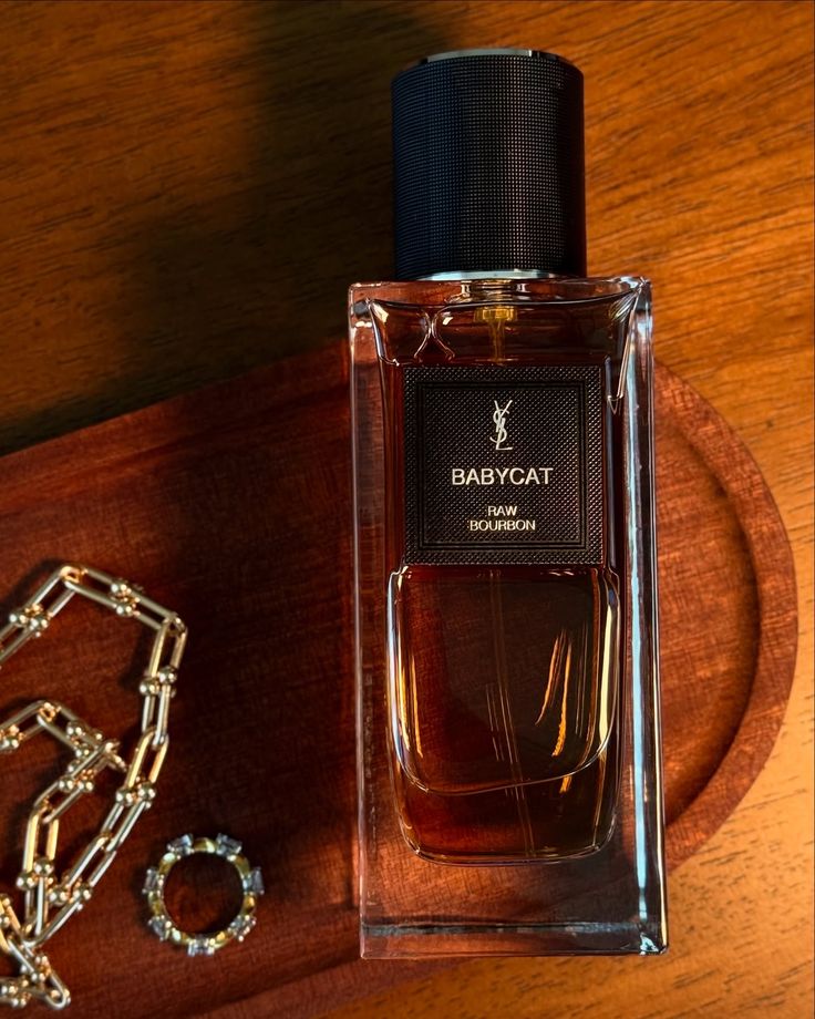 عطر ادکلن ایو سن لورن (وای اس ال) بیبی کت راو بوربون ادوپرفیوم مردانه-زنانه Yves Saint Laurent Babycat Raw Bourbon Unisex EDP